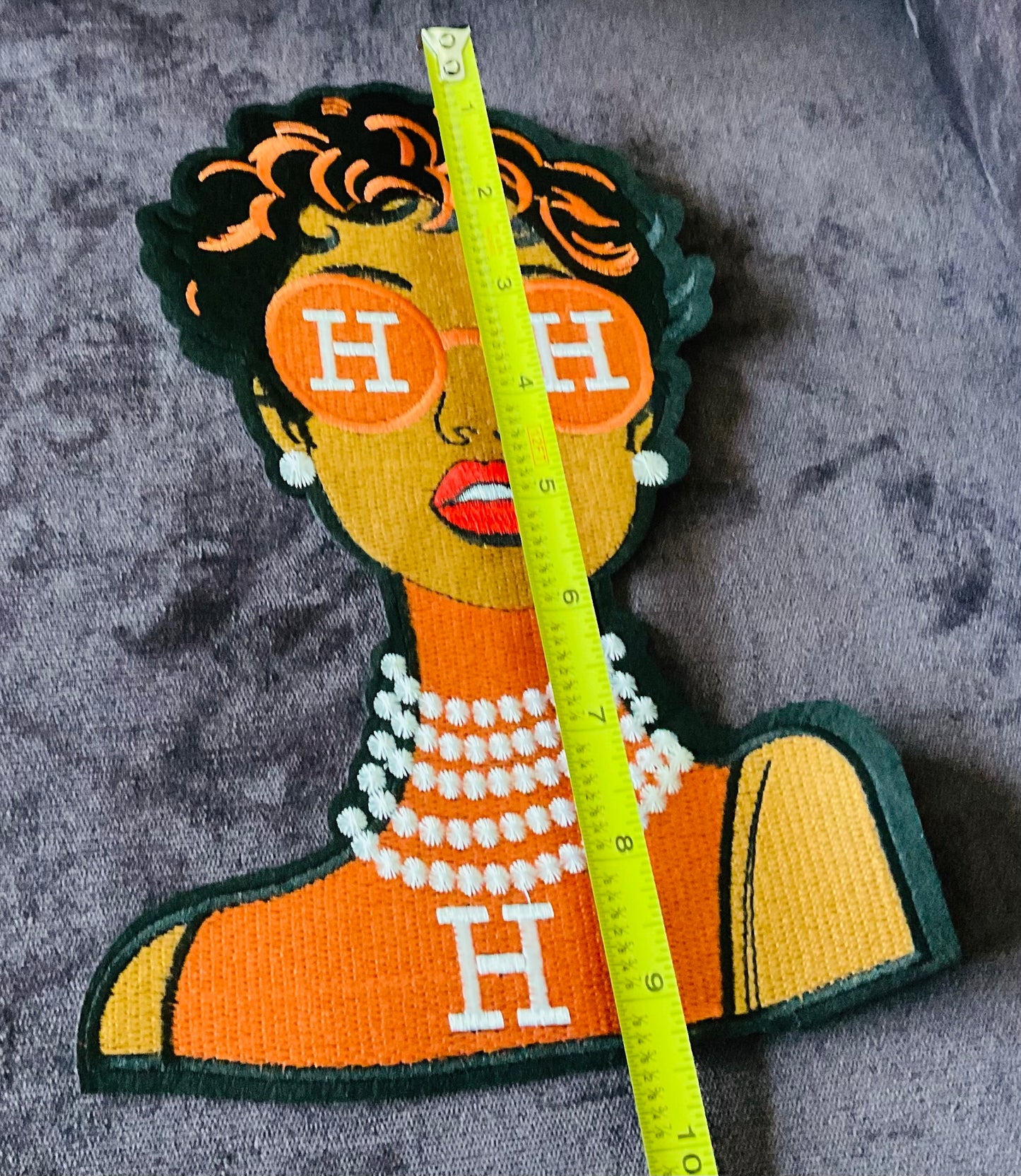 Fashion girl in Orange dress, orange glasses and pearls around the neck embroidery patch,