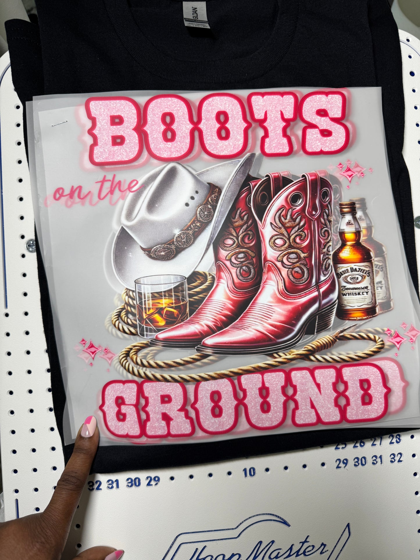 Pink boots on the ground tshirt with lasso and beverage design