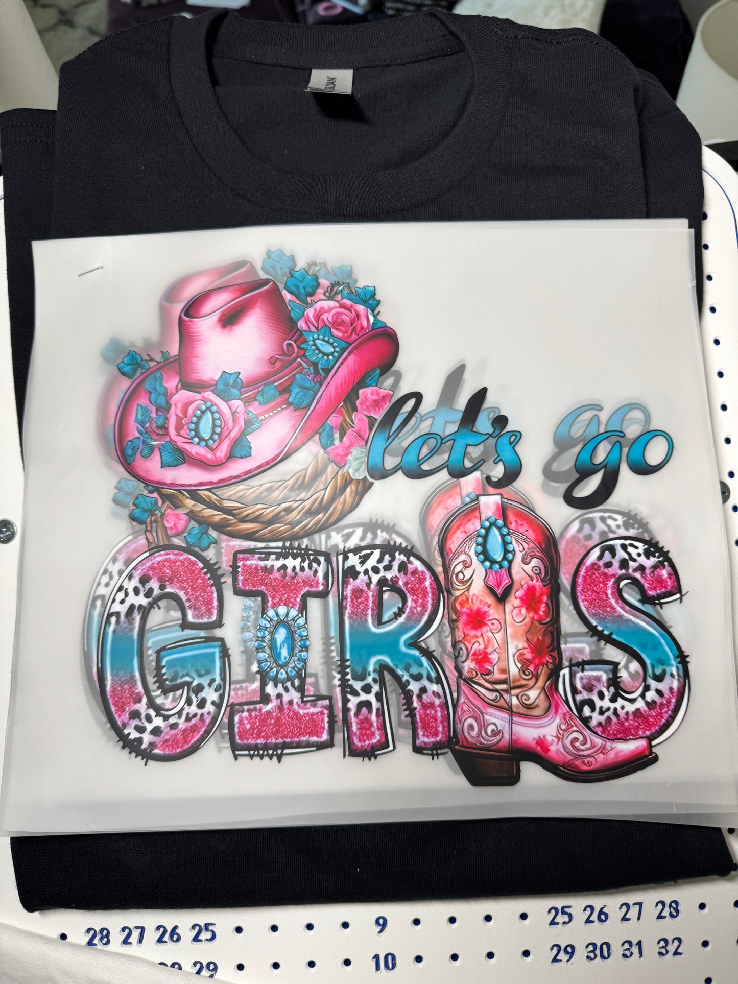 Let's go girls written in teal and pink lettering and design