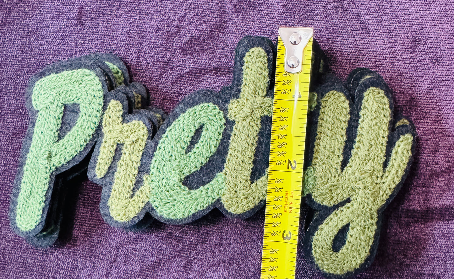 Pretty in white chenille or knitted green patch