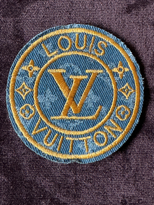 LV inspired embroidery circle patch, light denim material with writing in gold