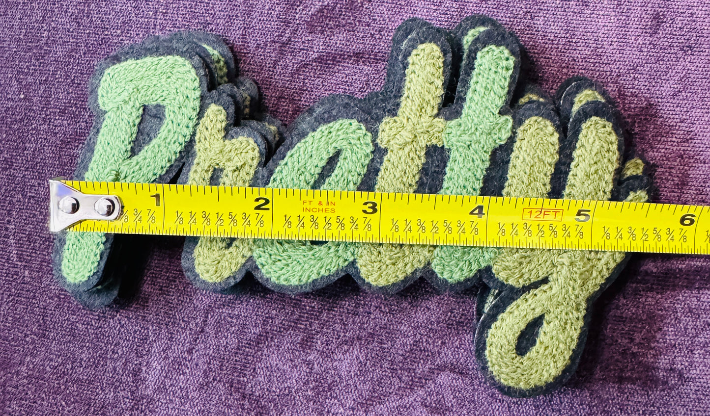 Pretty in white chenille or knitted green patch