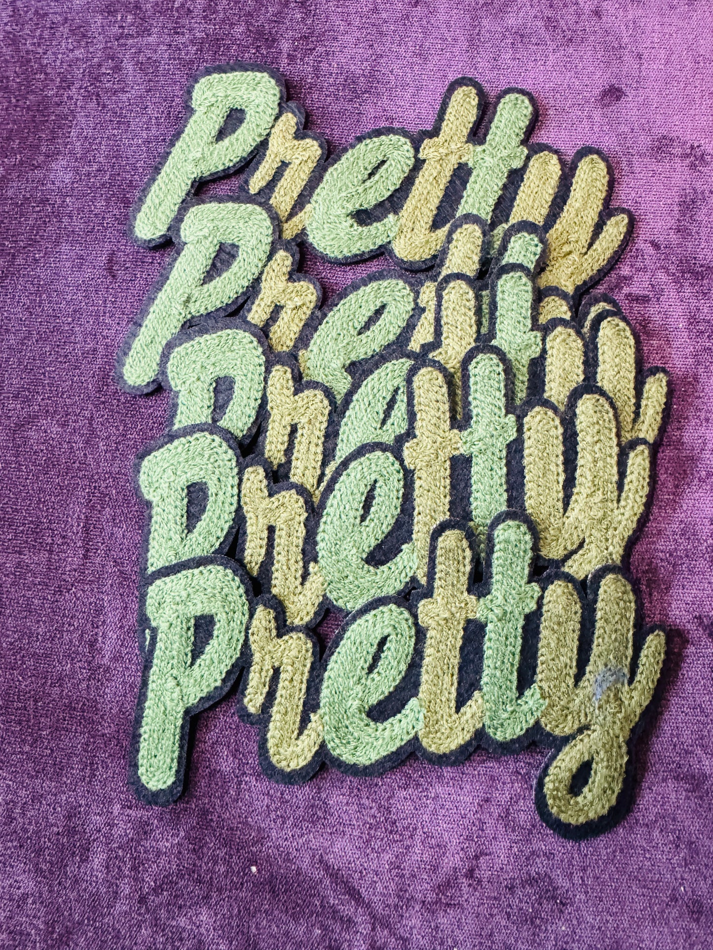 Pretty in white chenille or knitted green patch