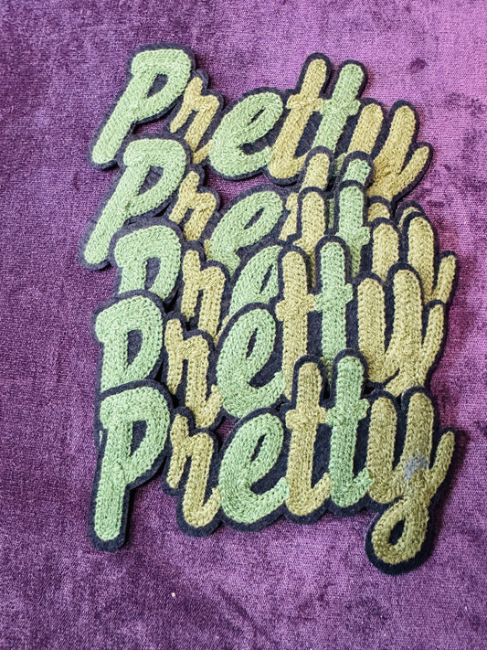 Pretty in white chenille or knitted green patch