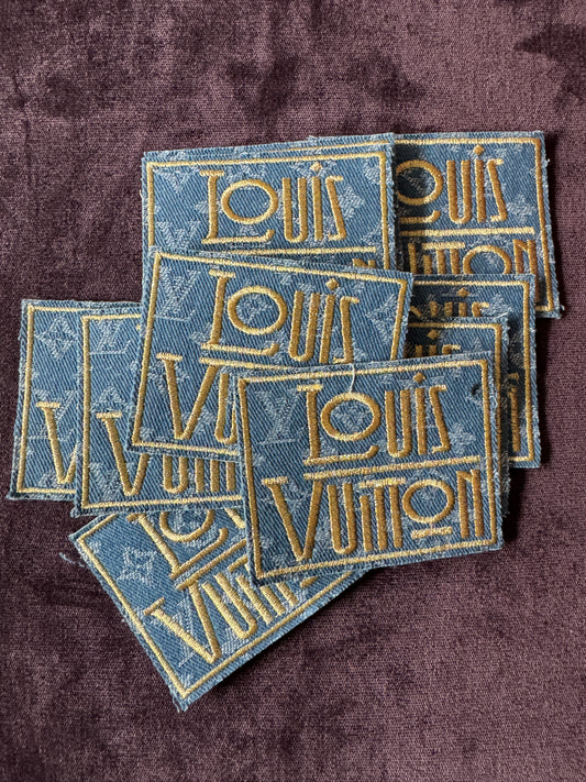 LV inspired embroidery square patch, light denim material with fancy writing in gold