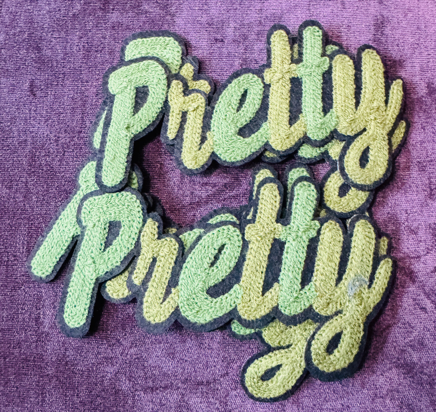 Pretty in white chenille or knitted green patch