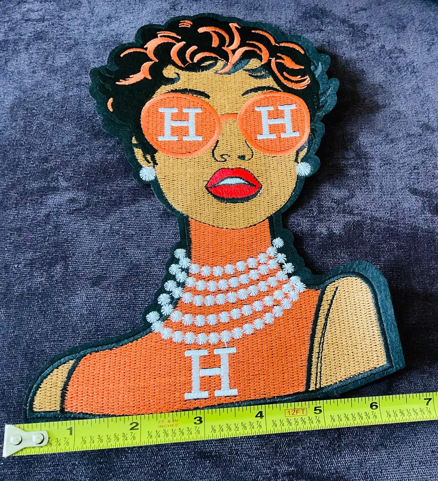 Fashion girl in Orange dress, orange glasses and pearls around the neck embroidery patch,