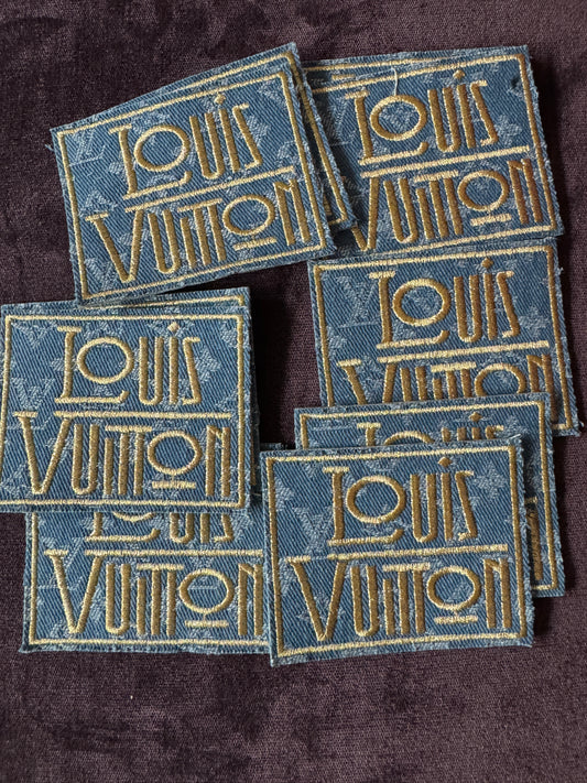 LV inspired embroidery square patch, light denim material with fancy writing in gold