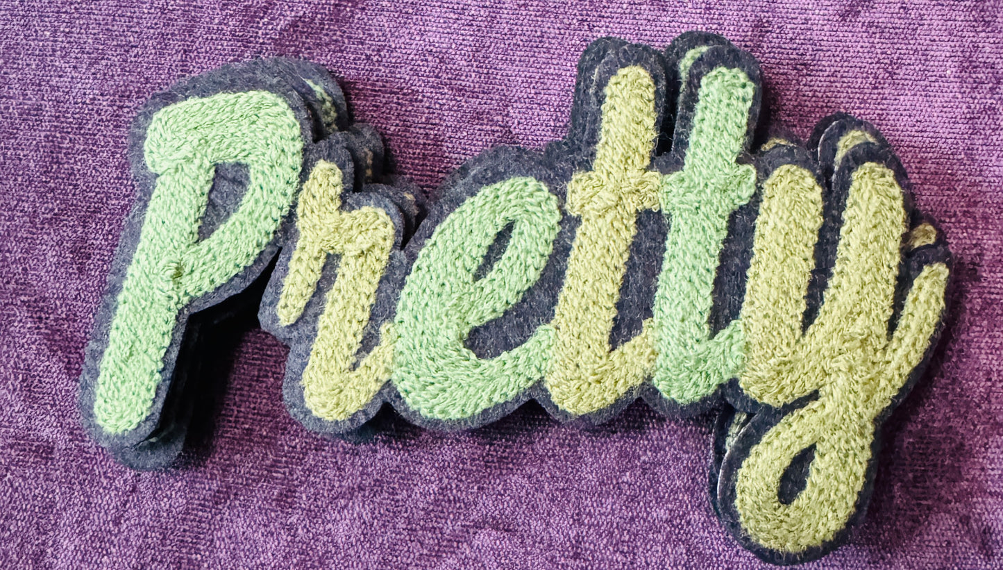 Pretty in white chenille or knitted green patch